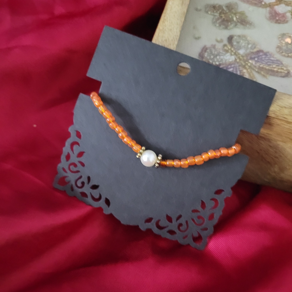 Elegant Orange Beaded Bracelet with Pearl Accent
